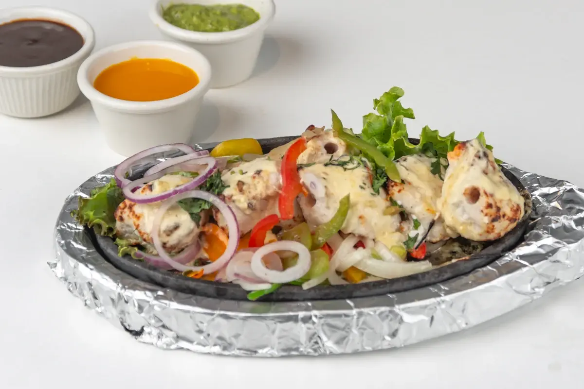 Traditional chicken curry dishes at Tandoor N Flame Red Deer, AB